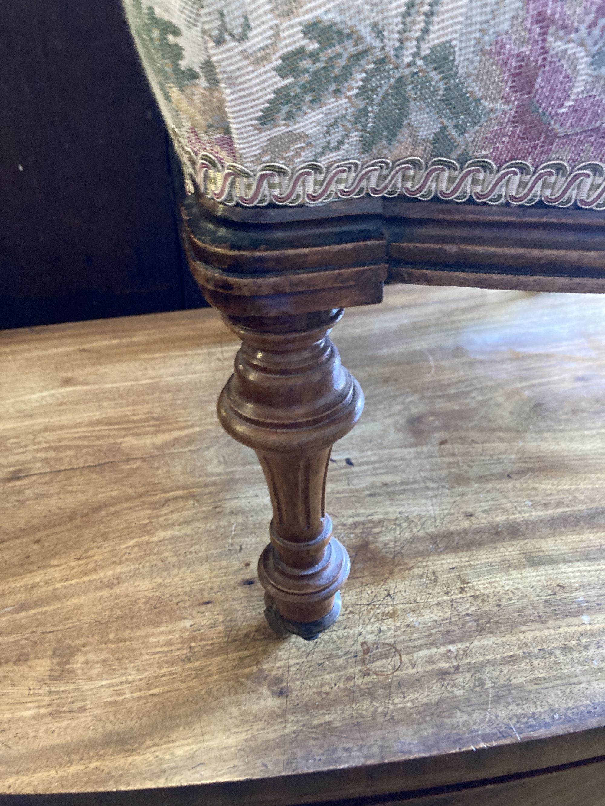 A Victorian carved walnut spoon back nursing chair, width 54cm, depth 56cm, height 80cm